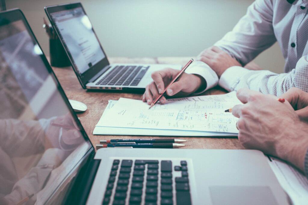 people working together to prepare taxes
