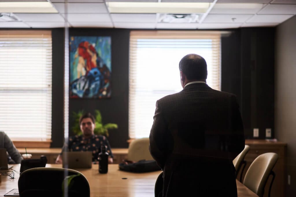 man presenting at a business meeting